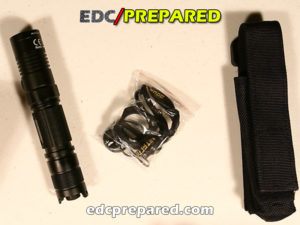 A photo of the Nitecore P12 Tactical Flashlight and accessories.